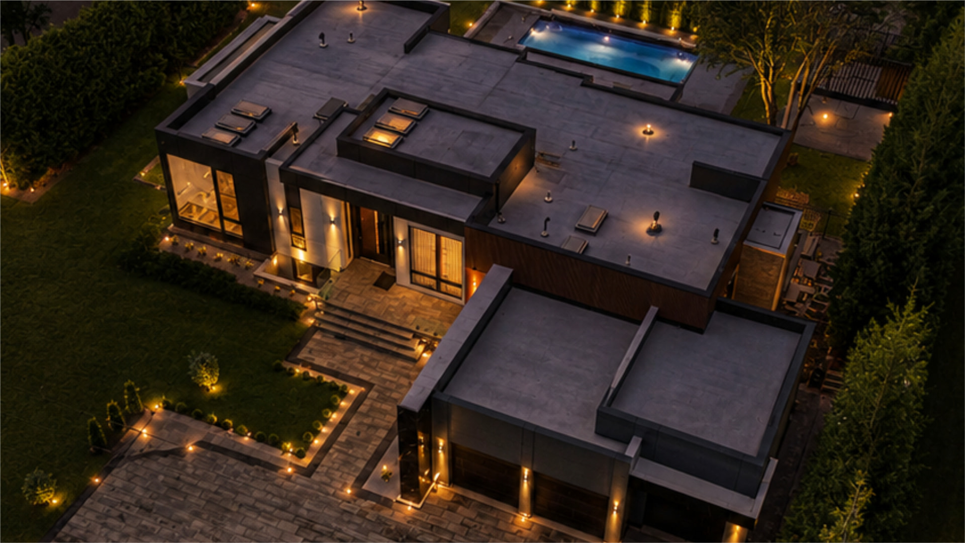 Aerial night view of a KingsGate custom home