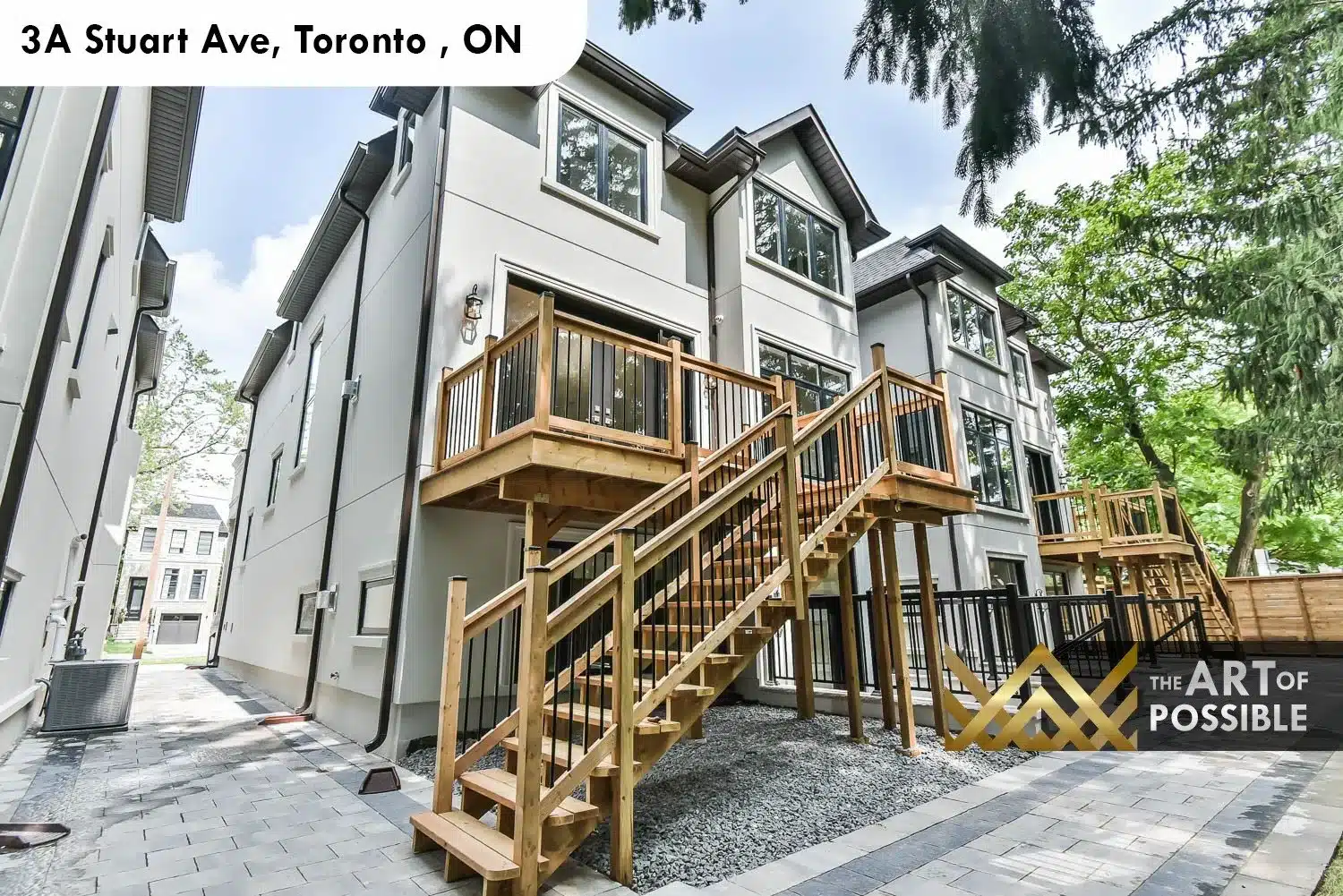Rear exterior of 3A Stuart Ave with wood deck, cedar pergola and walkout lower level